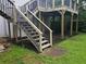 Backyard deck with stairs leading down to the yard; wood beam structure at 2811 Country Farms Ct, Snellville, GA 30039