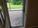 A brick back porch and backyard are visible through a screen door at 2811 Country Farms Ct, Snellville, GA 30039