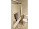 Neutral bathroom with a toilet, a shower with glass doors, and patterned tile floor at 2811 Country Farms Ct, Snellville, GA 30039