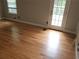 Bedroom featuring hardwood floors, a window for natural light, and a glass door to outside at 2811 Country Farms Ct, Snellville, GA 30039