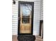 A lovely wooden front door with glass and a black screen door at 2811 Country Farms Ct, Snellville, GA 30039