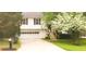 Charming two-story home featuring a well-manicured lawn and a two-car garage at 2811 Country Farms Ct, Snellville, GA 30039