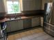 Bright kitchen featuring stainless steel appliances and tile floors at 2811 Country Farms Ct, Snellville, GA 30039