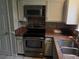 Modern kitchen equipped with stainless steel appliances and a granite countertop at 2811 Country Farms Ct, Snellville, GA 30039