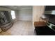 Bright kitchen featuring modern stainless steel appliances and tile floors at 2811 Country Farms Ct, Snellville, GA 30039