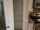 A kitchen pantry has white wire shelving for ample storage at 2811 Country Farms Ct, Snellville, GA 30039