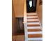 Staircase with hardwood steps and white risers at 2811 Country Farms Ct, Snellville, GA 30039