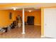 View of the finished basement with tile floors, neutral walls, and walkout access at 68 Paradise Pointe, Douglasville, GA 30134