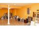 The finished basement offers tile floors, neutral walls, and a support beam at 68 Paradise Pointe, Douglasville, GA 30134