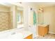 Bathroom featuring a bathtub, walk-in shower, dual vanities, and ample counter space at 68 Paradise Pointe, Douglasville, GA 30134