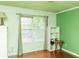 Bright bedroom with wood floors, large window and storage shelves at 68 Paradise Pointe, Douglasville, GA 30134