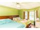 Bedroom with ceiling fan and hardwood floors has two beds and natural light at 68 Paradise Pointe, Douglasville, GA 30134