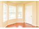Bright room featuring three large windows and a cream color scheme at 68 Paradise Pointe, Douglasville, GA 30134