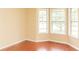 This room features three windows with bright, natural light and hardwood flooring at 68 Paradise Pointe, Douglasville, GA 30134