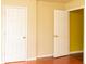Image shows the entry to a bedroom and hallway with neutral colors and hardwood flooring at 68 Paradise Pointe, Douglasville, GA 30134