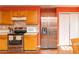 Bright eat-in kitchen featuring stainless appliances and wood cabinets at 68 Paradise Pointe, Douglasville, GA 30134