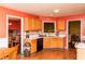 Spacious kitchen with wood cabinets and stainless steel sink at 68 Paradise Pointe, Douglasville, GA 30134