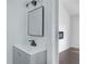 Stylish bathroom featuring a modern vanity, updated fixtures, and a sleek frameless mirror at 9263 Club View Trce, Riverdale, GA 30274