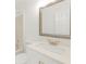 Bright bathroom featuring vanity with undermount sink, granite countertop, modern faucet, and large mirror at 9263 Club View Trce, Riverdale, GA 30274