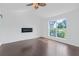Spacious bedroom with vaulted ceiling, ceiling fan, and large window offering backyard views at 9263 Club View Trce, Riverdale, GA 30274