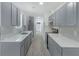 Modern kitchen with gray cabinets, subway tile backsplash, and stainless steel appliances at 9263 Club View Trce, Riverdale, GA 30274