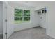 Convenient laundry room with a window providing ample natural light and tiled floors at 9263 Club View Trce, Riverdale, GA 30274