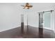 Inviting main bedroom with ceiling fan, and a modern sliding door for the en-suite bathroom at 9263 Club View Trce, Riverdale, GA 30274