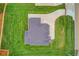 Aerial view of a modern home showcasing landscaping, a driveway and a neutral-toned roof at 3205 Bold Springs Rd, Dacula, GA 30019