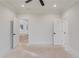 Bright bedroom features neutral walls, trim and doors, plus black hardware and ceiling fan at 3205 Bold Springs Rd, Dacula, GA 30019