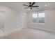 Bright bedroom featuring neutral walls, a large window, and an ensuite bathroom at 3205 Bold Springs Rd, Dacula, GA 30019