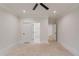 This bedroom boasts white trim, ceiling fan, and doors leading to an ensuite bathroom and closet at 3205 Bold Springs Rd, Dacula, GA 30019