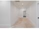 Hallway features neutral walls, white trim, recessed lighting, and doors to various rooms at 3205 Bold Springs Rd, Dacula, GA 30019
