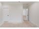Hallway with white doors and trim, showing access to various areas of the home at 3205 Bold Springs Rd, Dacula, GA 30019