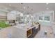 Bright, spacious kitchen with marble countertops, large windows and modern pendant lighting at 3205 Bold Springs Rd, Dacula, GA 30019
