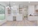 Modern kitchen with open shelving, custom cabinets, and a wine rack at 3205 Bold Springs Rd, Dacula, GA 30019