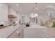 Stunning kitchen with marble countertops, modern appliances, and a beautiful staircase at 3205 Bold Springs Rd, Dacula, GA 30019