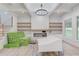 Bright and spacious living room features custom shelves, a fireplace, and hardwood floors with finishing touches needed at 3205 Bold Springs Rd, Dacula, GA 30019