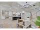 Open-concept living space with modern kitchen, hardwood floors ready for finishing, and contemporary lighting at 3205 Bold Springs Rd, Dacula, GA 30019