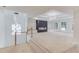 Open-concept living space featuring modern lighting, a fireplace, and large windows with outdoor views at 3205 Bold Springs Rd, Dacula, GA 30019