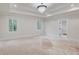 Bright main bedroom featuring ample natural light, neutral tones, and an ensuite bathroom at 3205 Bold Springs Rd, Dacula, GA 30019