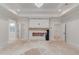 Spacious main bedroom featuring a tray ceiling, a fireplace, and doorways to other rooms at 3205 Bold Springs Rd, Dacula, GA 30019