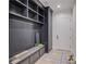 Well-organized mudroom featuring custom shelving, a bench with storage, and stylish design elements at 3205 Bold Springs Rd, Dacula, GA 30019