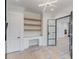 Chic home office with built-in shelves, modern lighting, and hardwood floors, ready for finishing at 3205 Bold Springs Rd, Dacula, GA 30019