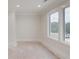 Bright room with white trim, neutral walls, and large windows offering natural light at 3205 Bold Springs Rd, Dacula, GA 30019