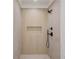 Modern shower featuring vertical tile and black fixtures, offering a sleek design at 3205 Bold Springs Rd, Dacula, GA 30019