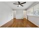 A bright bedroom with two closet doors and a large window at 346 Carpenter Dr # 77, Sandy Springs, GA 30328
