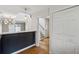 Hallway with pantry and open view to kitchen area with eating bar at 346 Carpenter Dr # 77, Sandy Springs, GA 30328