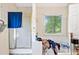 Bathroom featuring a shower/tub, a towel rack, and a window at 5181 Saint Claire Pl, Powder Springs, GA 30127