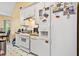 Efficient kitchen with white appliances and ample cabinet space at 5181 Saint Claire Pl, Powder Springs, GA 30127