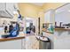 Functional kitchen with white cabinets and a view into the living room at 5181 Saint Claire Pl, Powder Springs, GA 30127